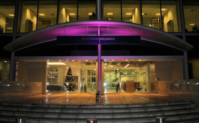Enterprise Holdings building with purple lighting
