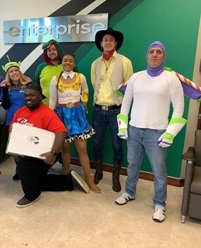 Employees in Toy Story themed Halloween costumes