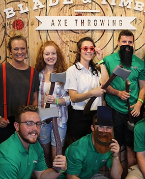 Employees at an axe throwing event