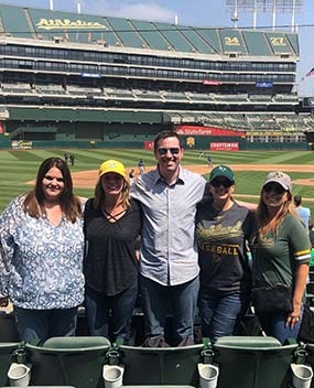 Employees at a baseball game