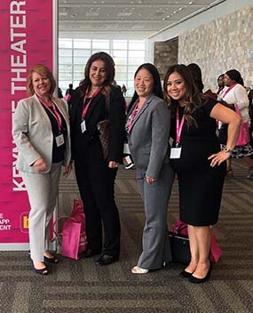 Female employees at a conference
