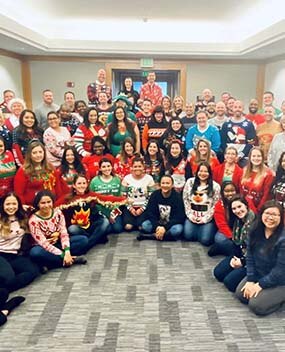 Employees in holdiay sweaters