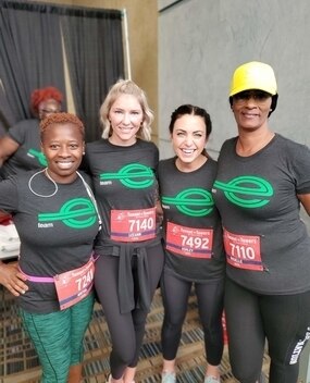 Four employees at a race