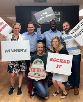 Employees with motivational signs