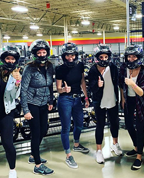 Employees in motorcycle helmets