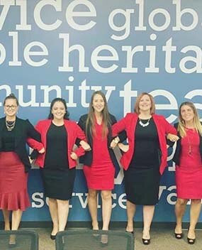 Women wearing red and black attire