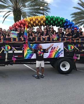 Employees on a float for PRIDE
