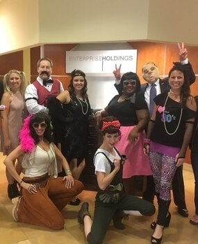 Employees in Halloween costumes