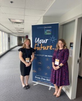 Two employees at a career presentation 