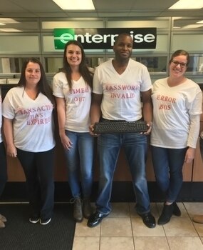 Employees in computer error themed t-shirts
