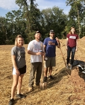 Employees working with shovels