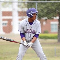 Ty with a bat in his baseball uniform