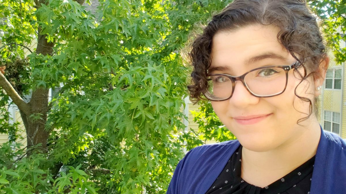 Selfie of Morgan in front of a tree