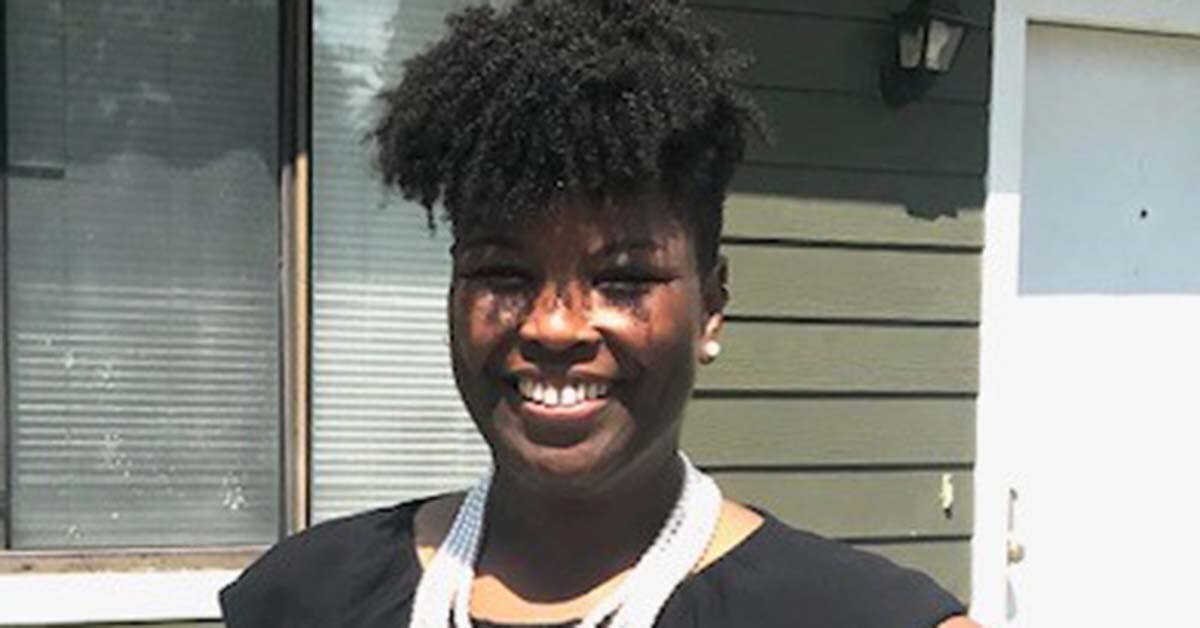 Deana B. Headshot in front of her house