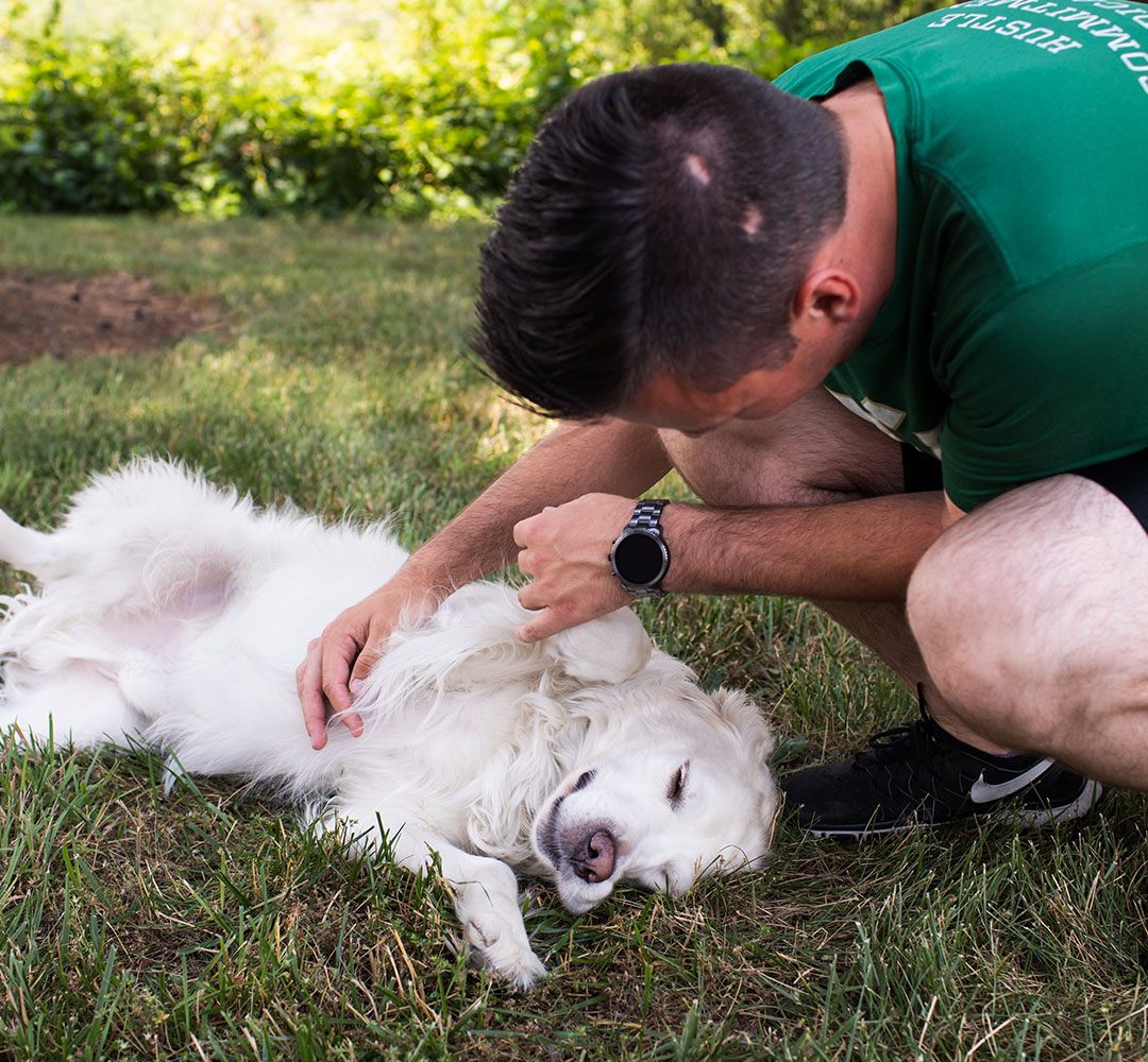 Scott giving Stanley a belly rub