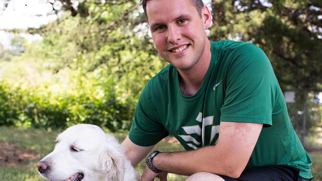 Scott M. with his service dog, Stanley