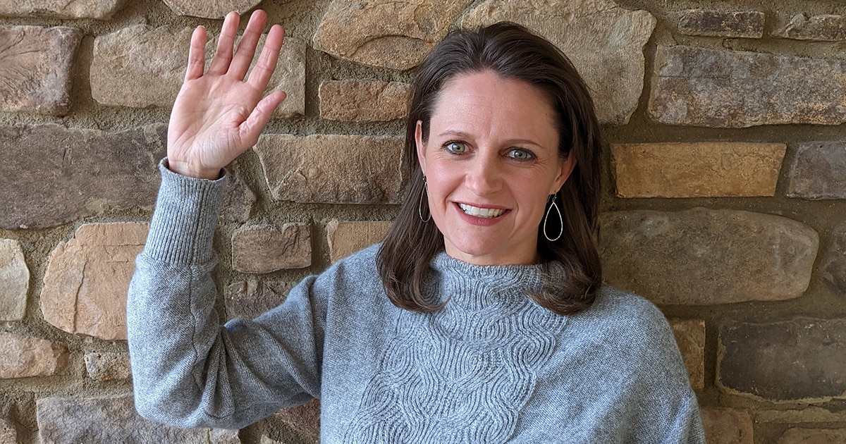 Jodi F., Director of Fleet Management, raising her right hand