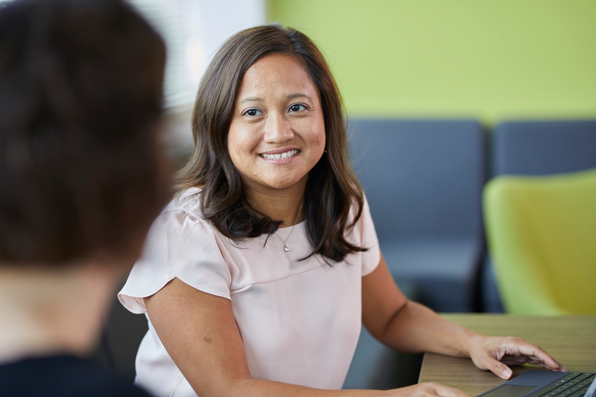 Employee smiling at antoher employee