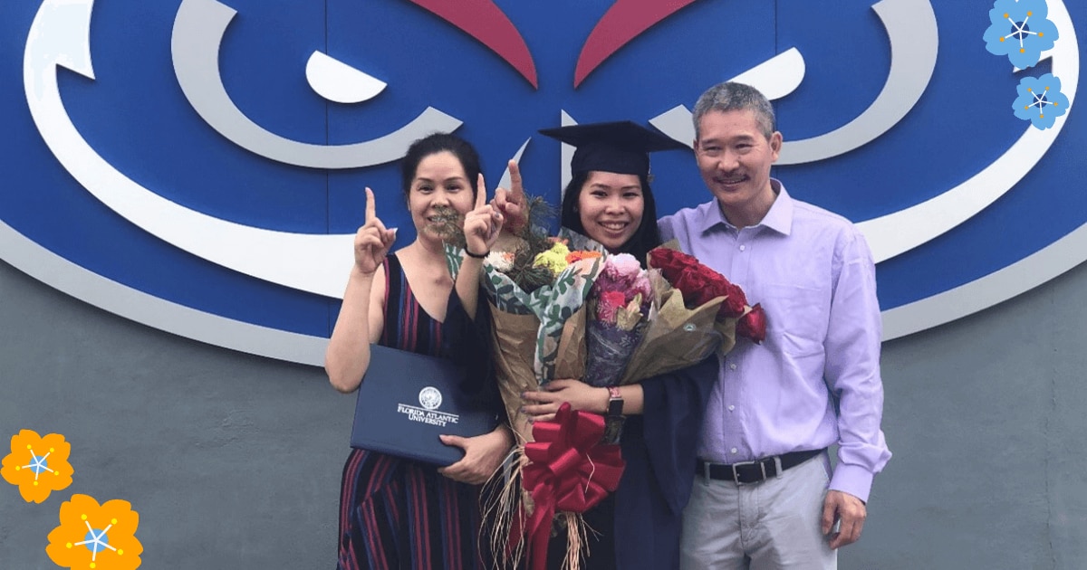 Lili P. with her parents at graduation