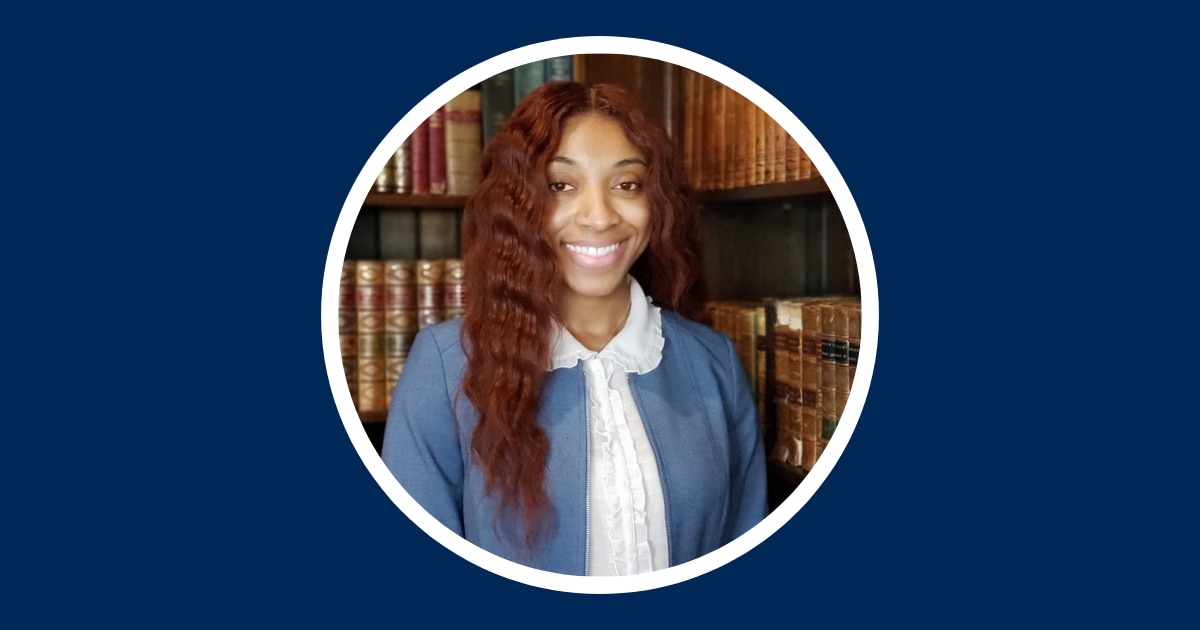 Danielle Eubanks Headshot in library