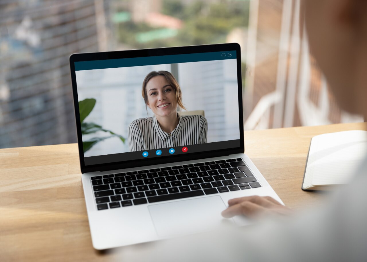 woman on computer giving interview