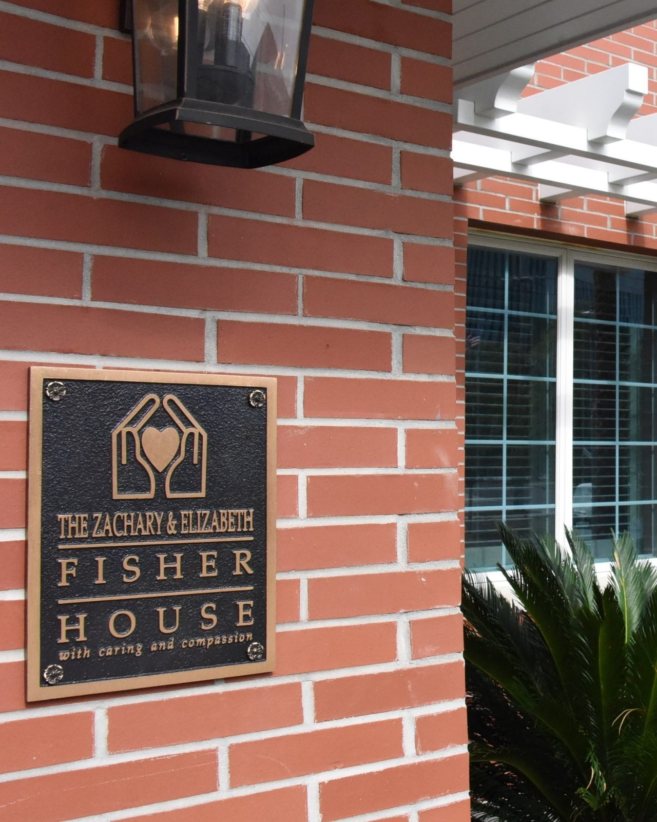 A man and a woman hold a certificate together