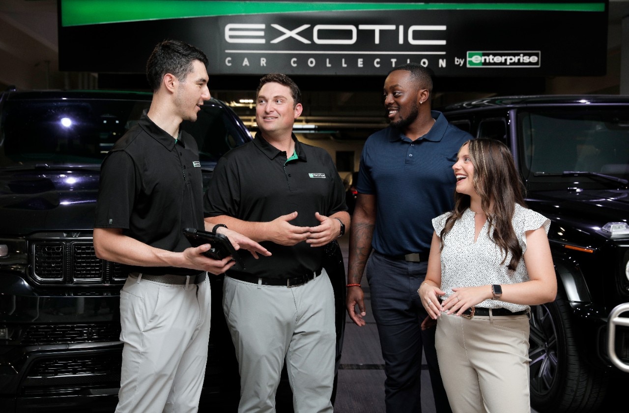 Group of Enterprise Mobility employees talking outside.