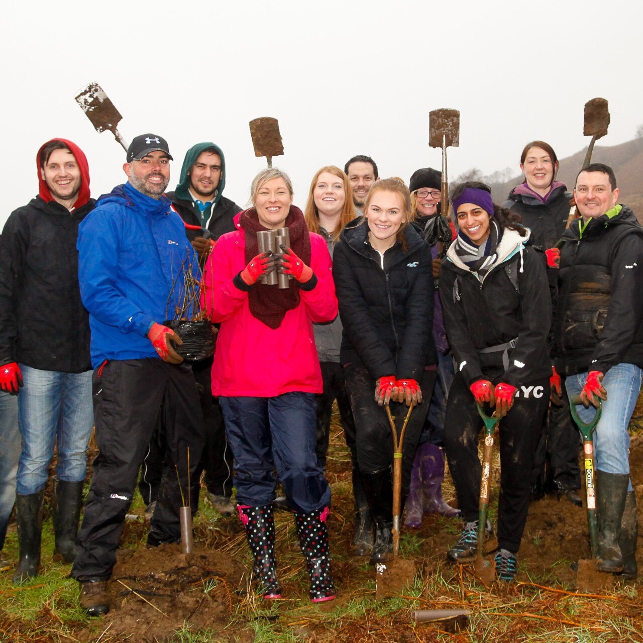 Enterprise Mobility team members planting trees as part of the partnership with the Arbor Day Foundation®