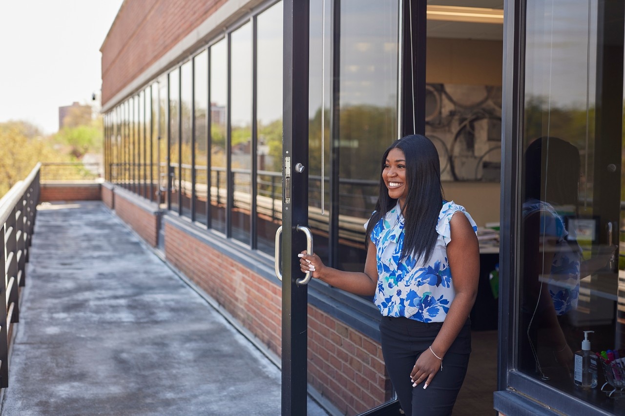 Employee opening door